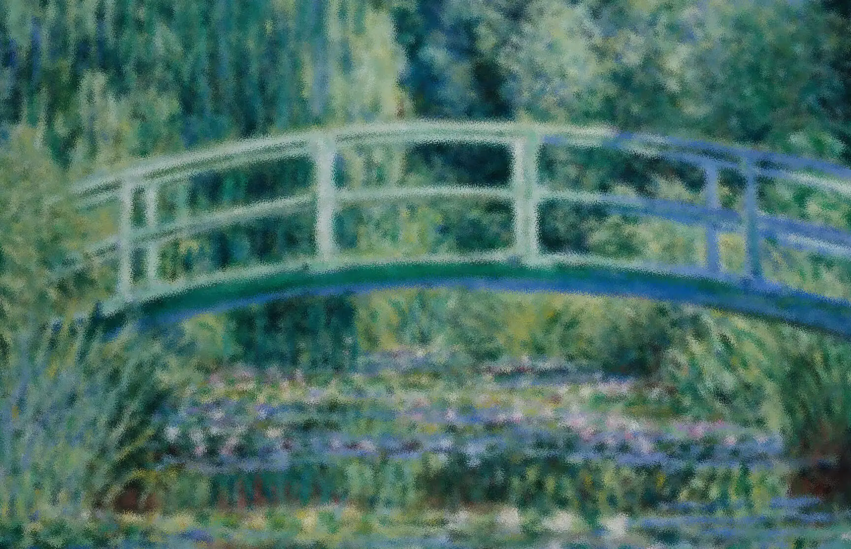 Monet's Japanese bridge over a pond of water lilies